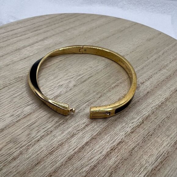 Kate Spade New York Black Enamel and Gold Tone Wave Twist Bangle Bracelet - Picture 9 of 11